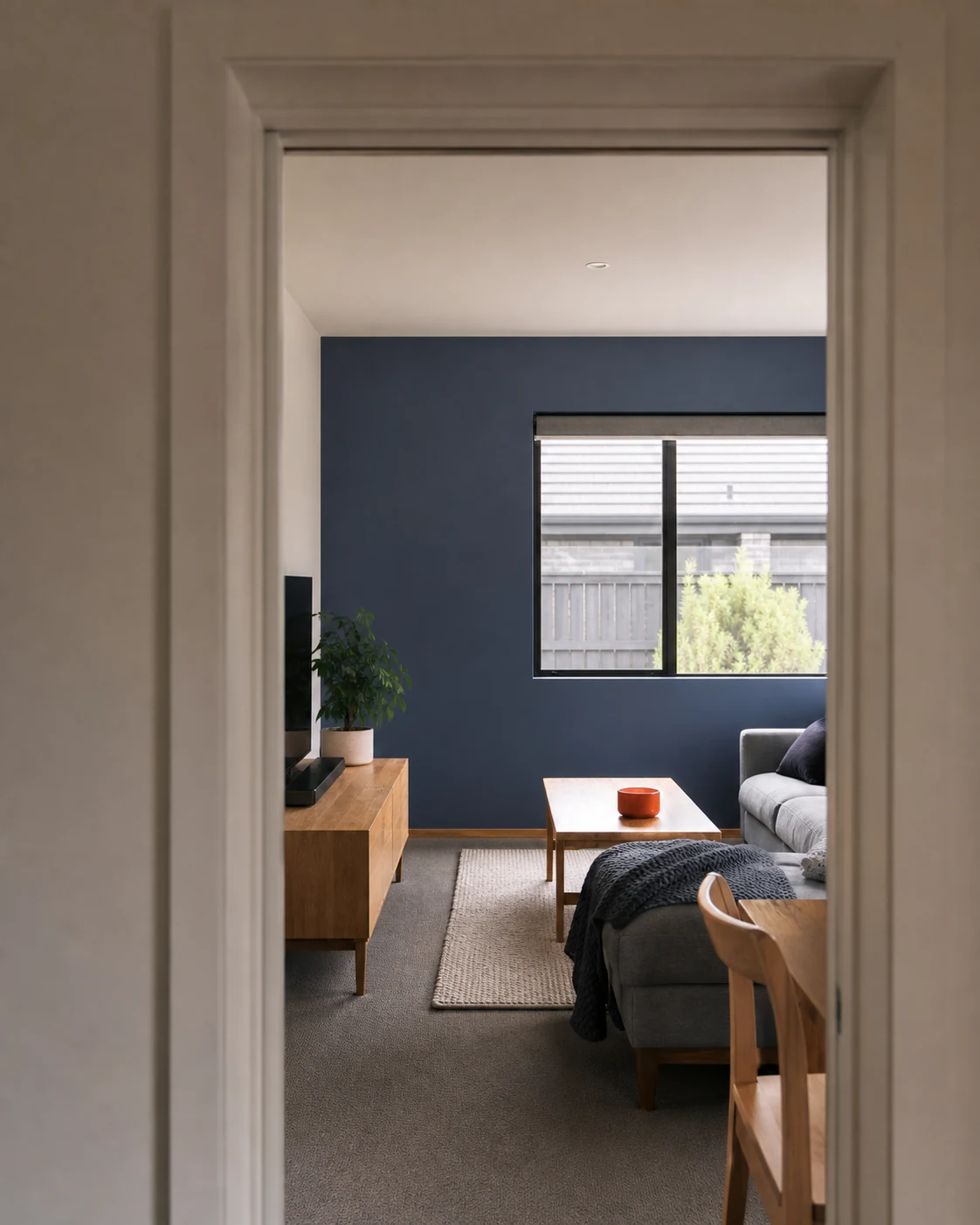 Fresh interior repaint with crisp navy feature wall and white trim